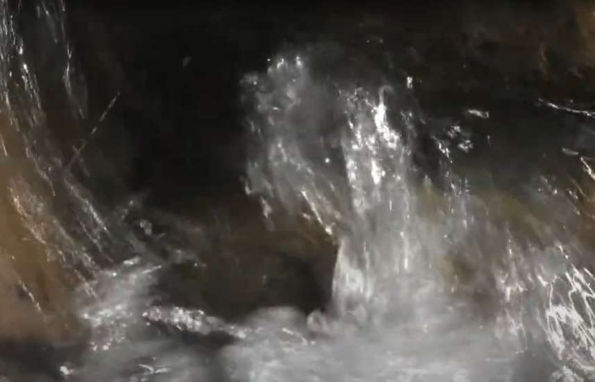 A close up of waves from a rushing stream.