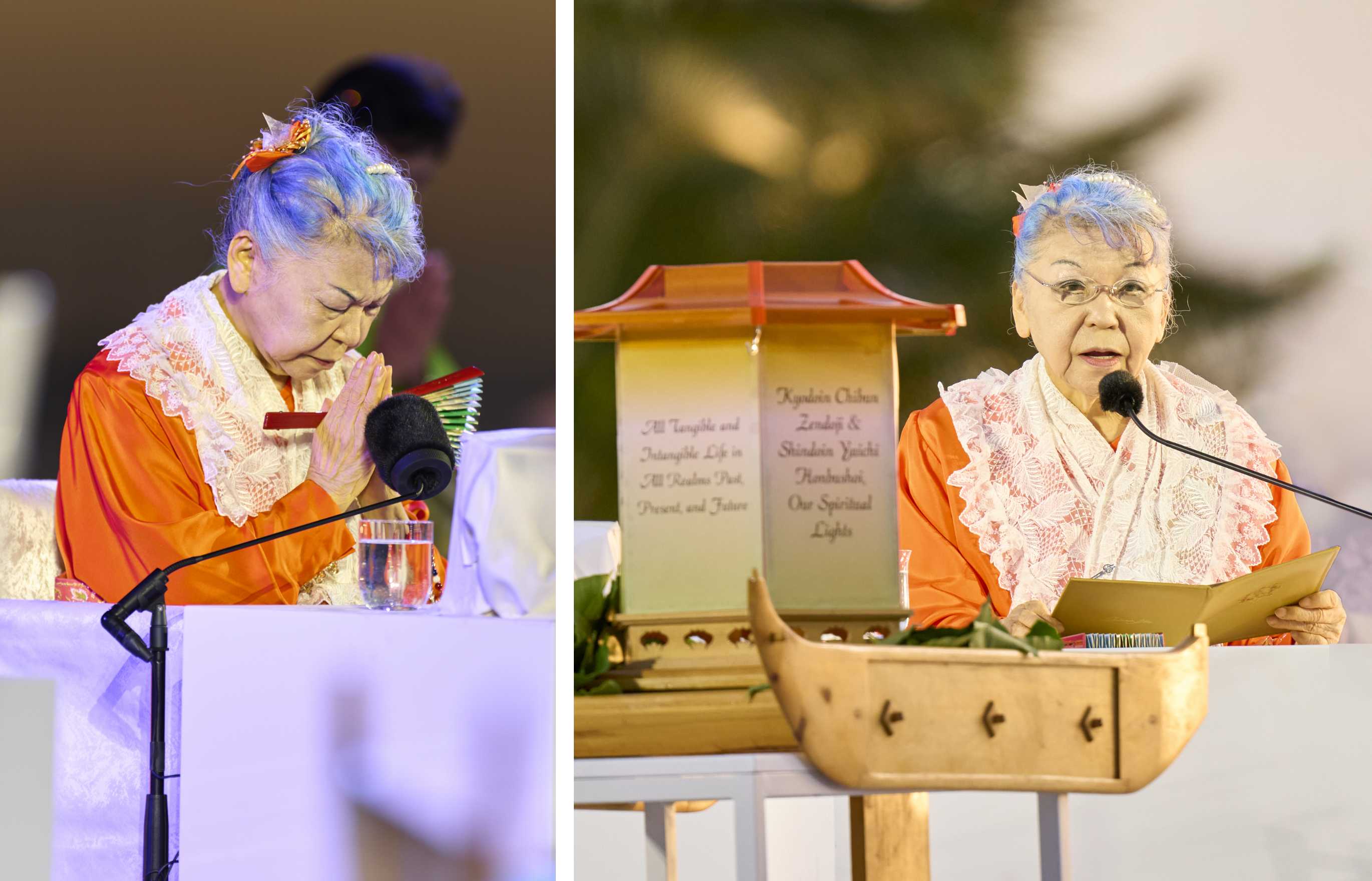 (Left) An grey-haired Japanese woman dressed in vermillion robes and a white shawl of lace, seated on a stage before a microphone, intently bows her head in prayer, a folding fan clasped in her hands pressed together in a prayerful gesture. (Right) A gray-haired Japanese woman wearing vermillion robes and a white lace shawl sits at a table before a microphone, delivering an address; a large lantern for floating is visible in the foreground; an evening sky, palm trees, and an attending priest can be seen in the background.