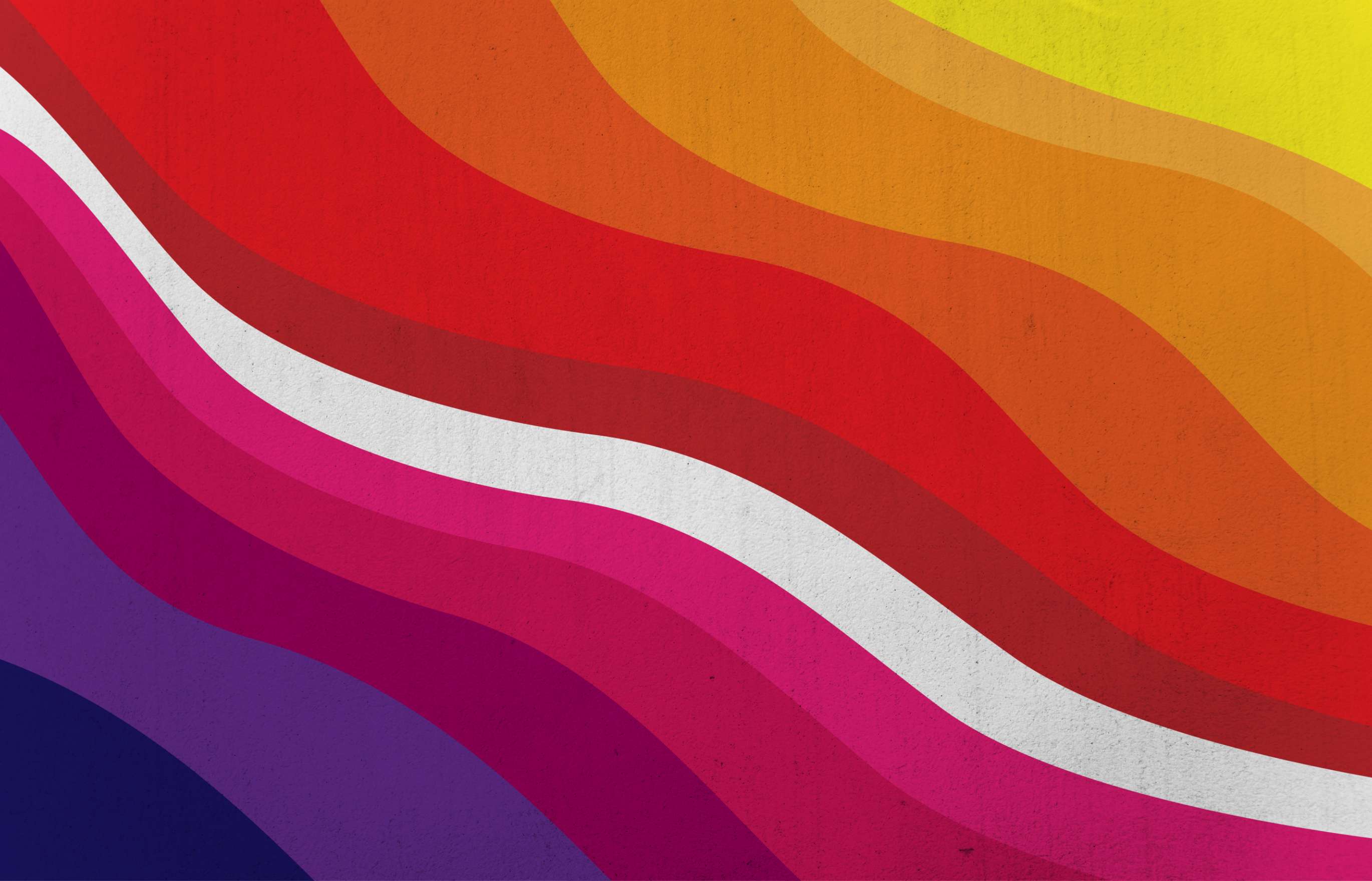 An abstract illustration of diagonally aligned parallel waves of color that move gradually through a gradient from deep purple to yellow, with a single white wave in the middle.